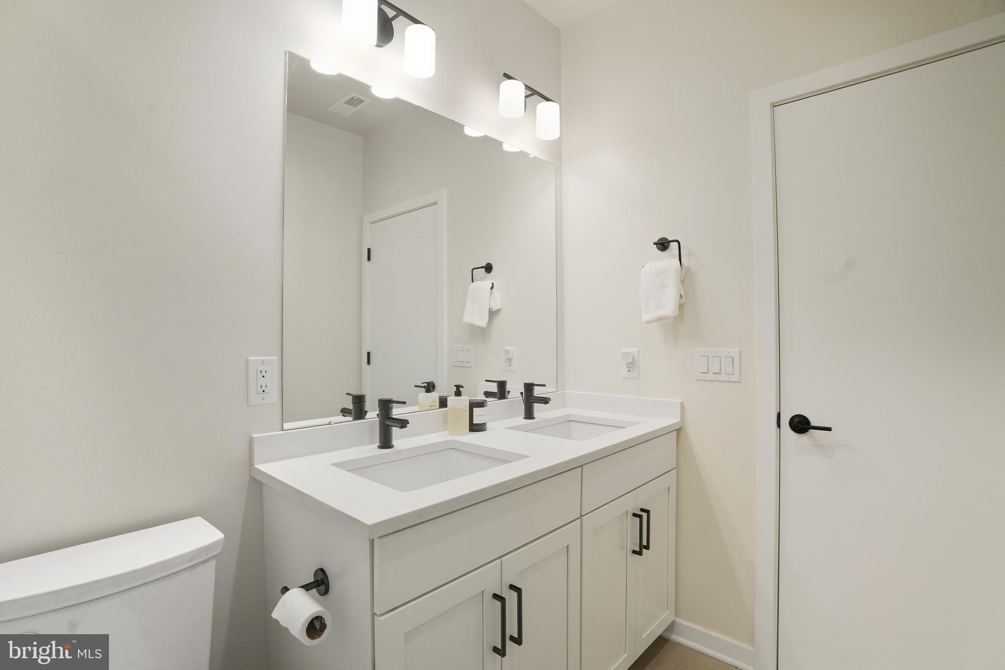 3112 Pierview Lane Philadelphia, PA 19125 - Photo 21 of 39 a bathroom with a sink toilet and mirror