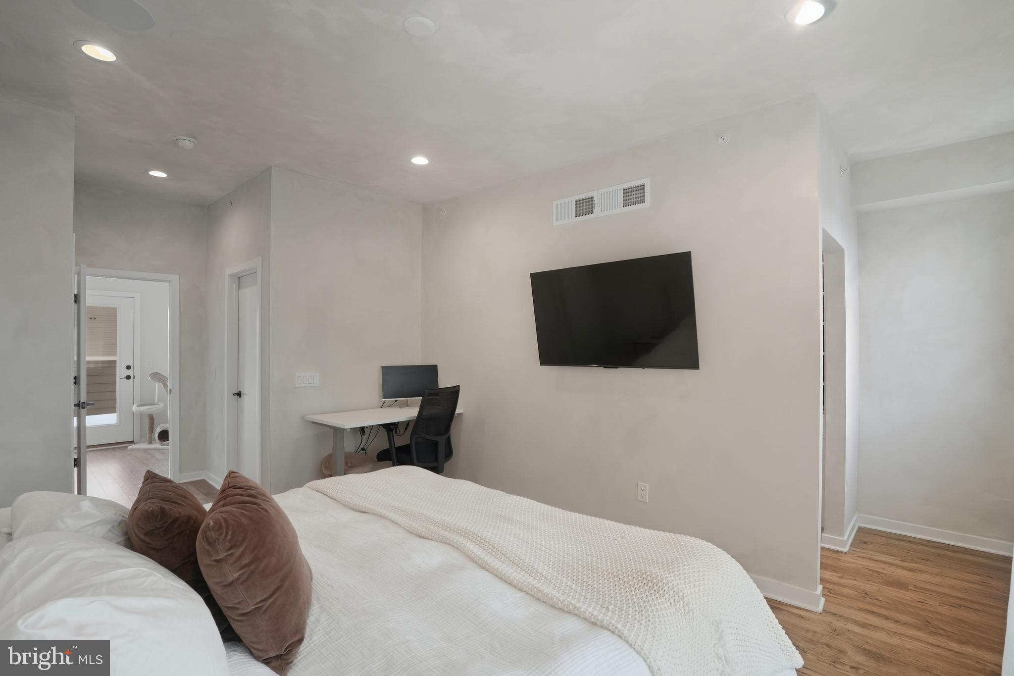 3112 Pierview Lane Philadelphia, PA 19125 - Photo 29 of 39 a bedroom with a bed and a flat screen tv