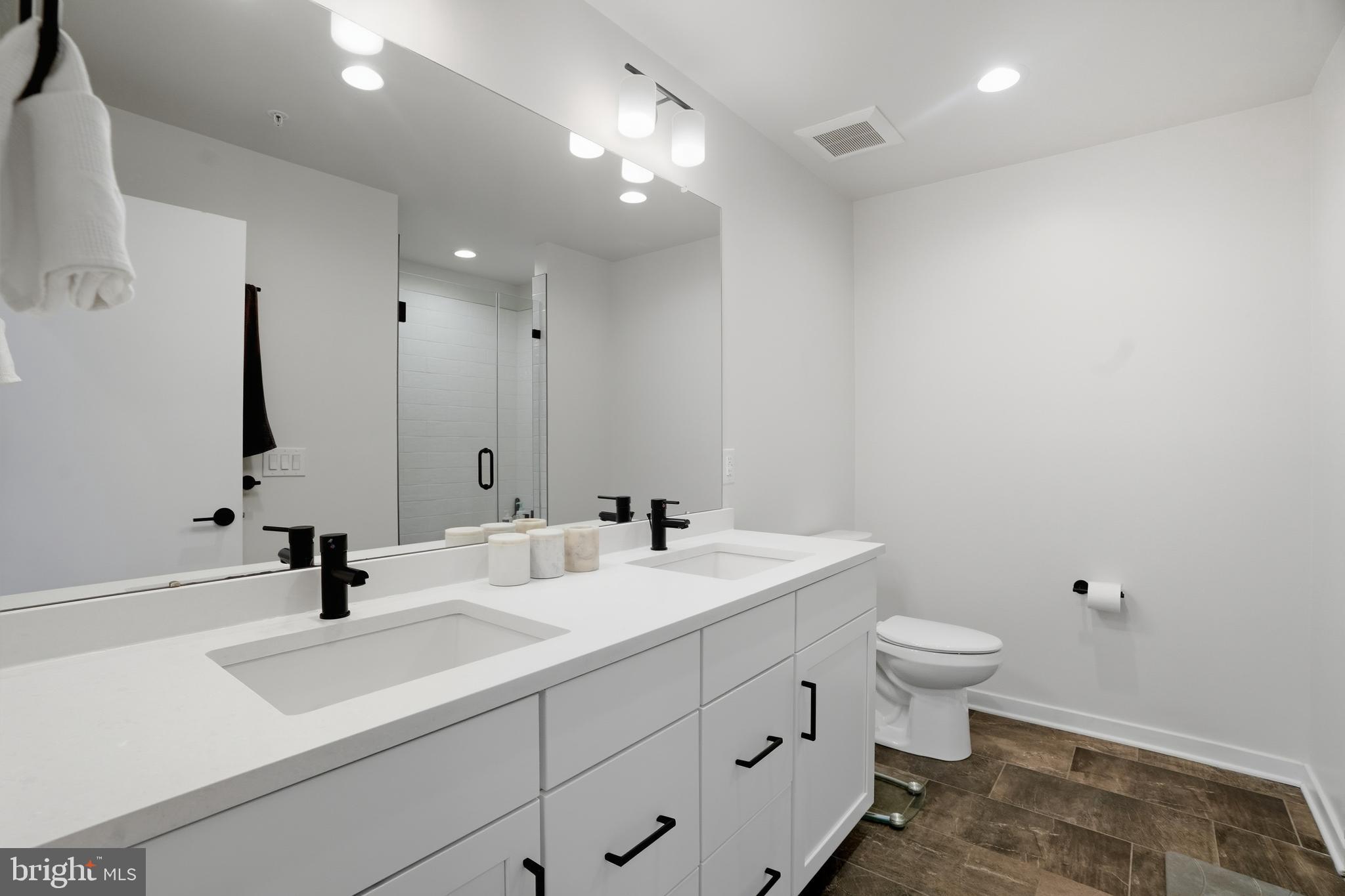 3112 Pierview Lane Philadelphia, PA 19125 - Photo 31 of 39 a bathroom with a sink and a mirror