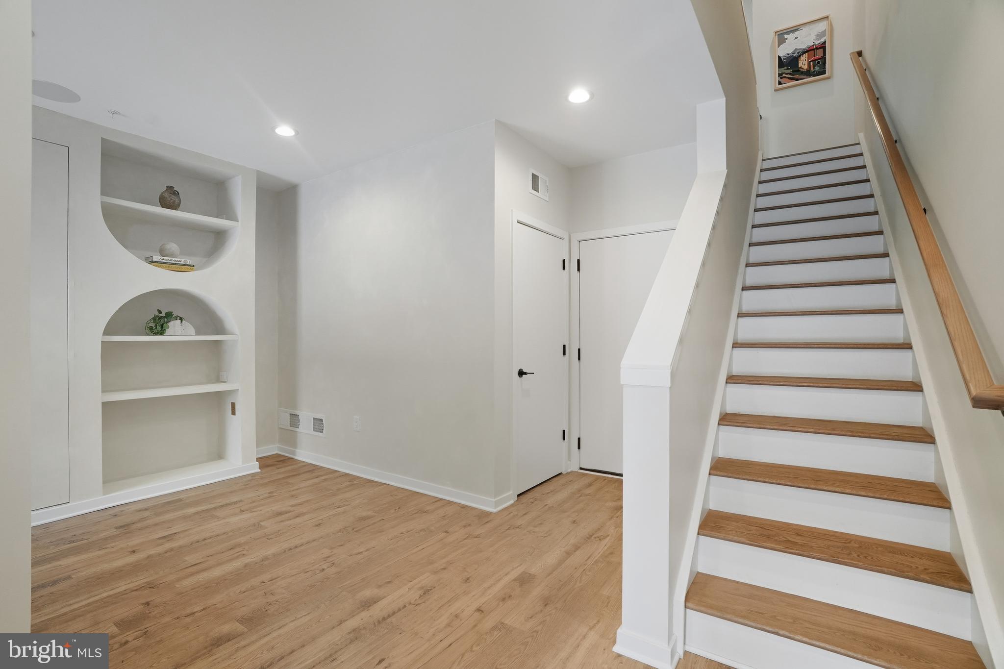 3112 Pierview Lane Philadelphia, PA 19125 - Photo 5 of 39 a view of a livingroom with wooden floor and stairs