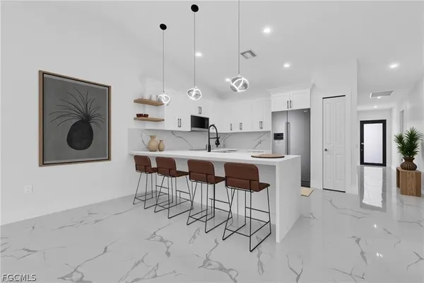 a kitchen with cabinets and window