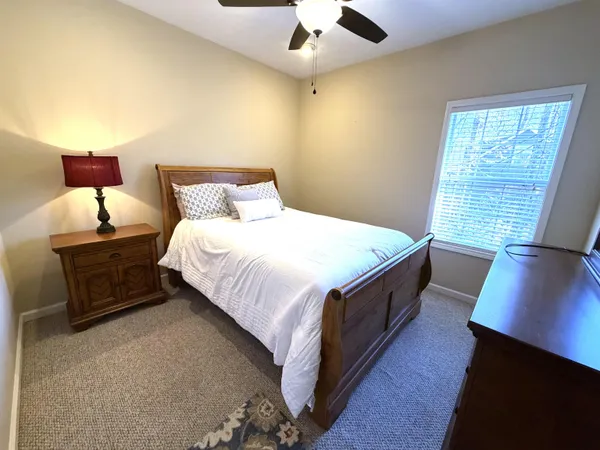 a bathroom with a sink a toilet and a shower