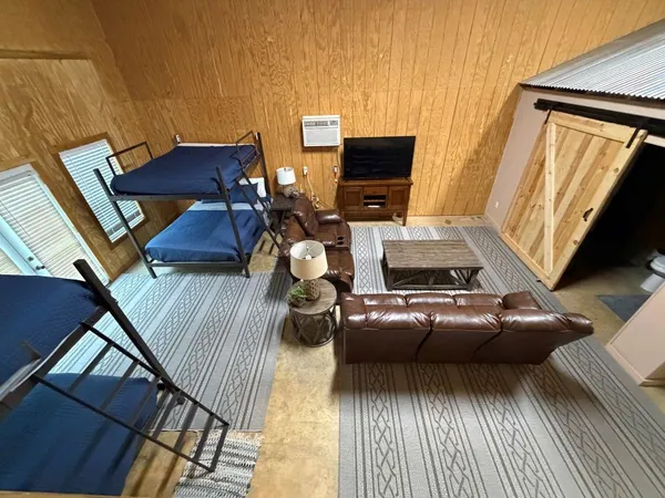 a room with furniture and a flat screen tv