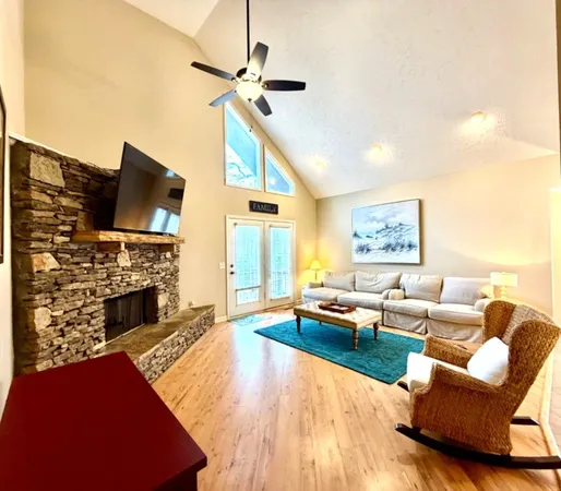 a living room with furniture fireplace and a flat screen tv