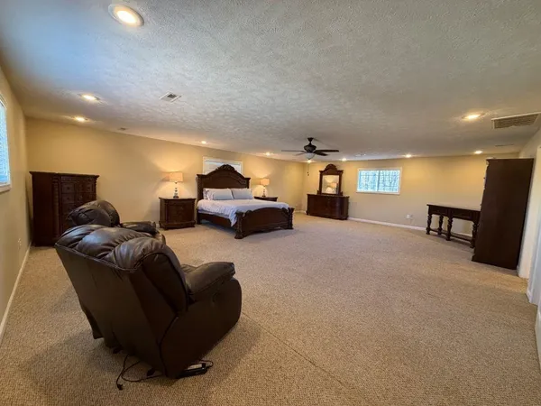 a spacious bathroom with a double vanity sink and a mirror