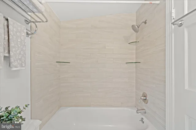 a bathroom with a sink vanity and mirror