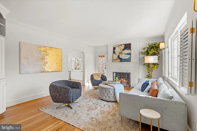 a living room with furniture rug and window