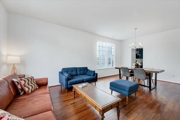 a kitchen with a refrigerator a stove top oven a sink and dishwasher with wooden cabinets