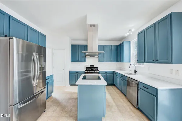 a spacious bedroom with a bed and a window