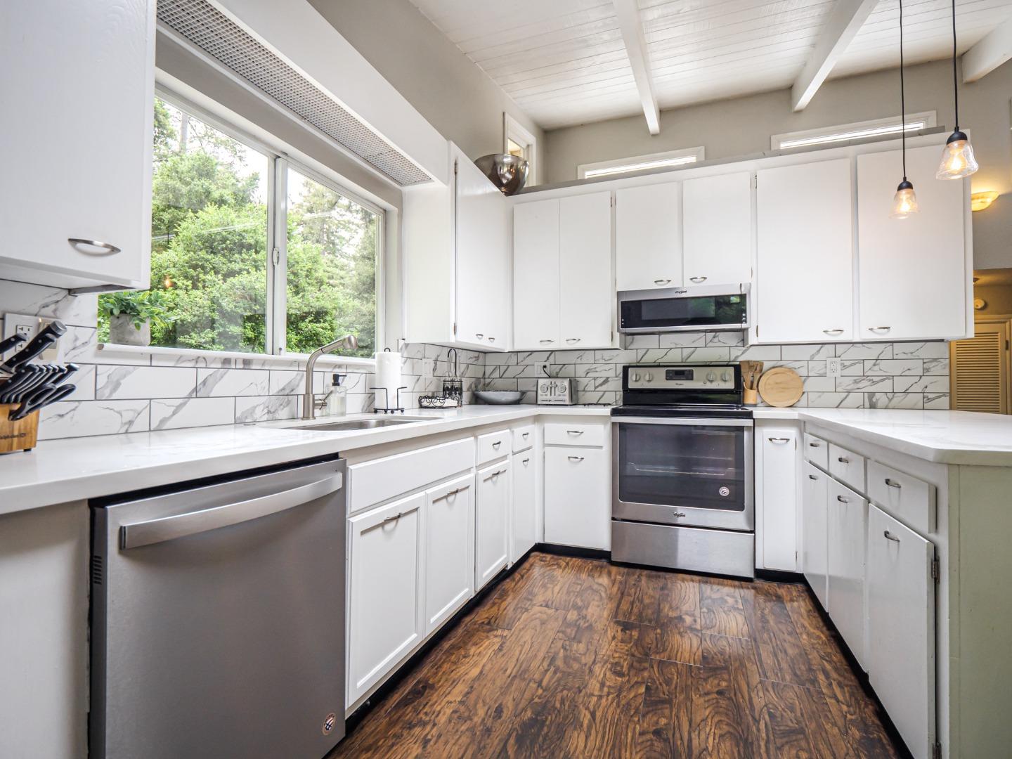757 Cathedral Drive Aptos, CA 95003 - Photo 17 of 32 a kitchen with appliances cabinets a sink and a window