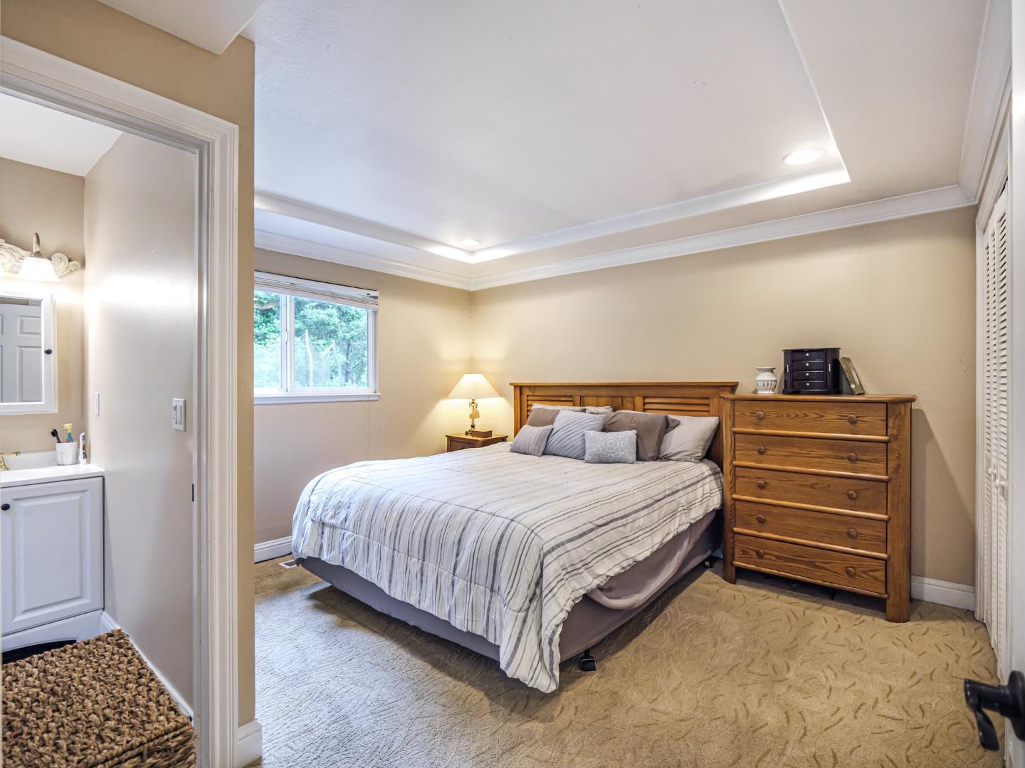 757 Cathedral Drive Aptos, CA 95003 - Photo 21 of 32 a bedroom with a bed and cabinets