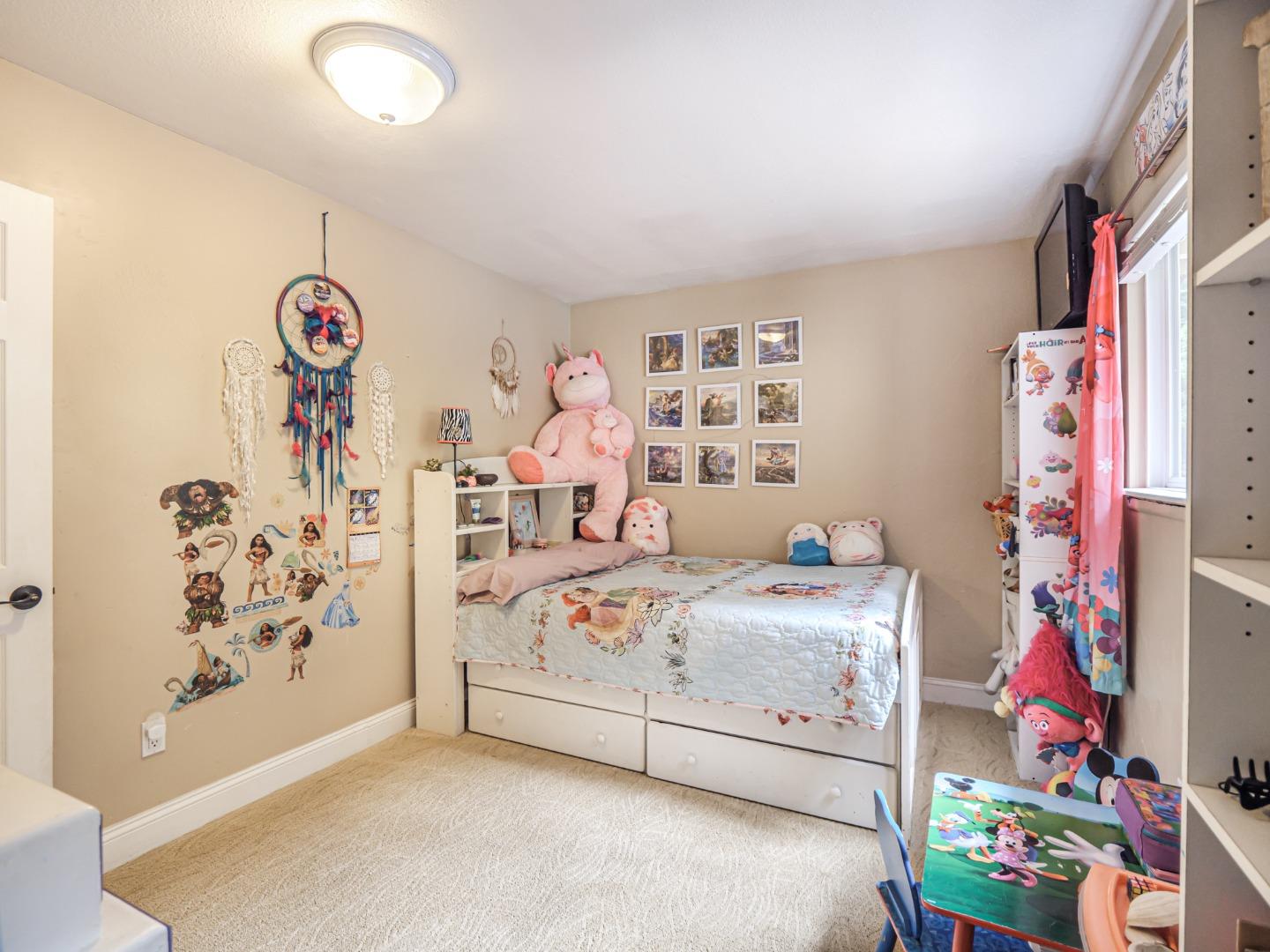 757 Cathedral Drive Aptos, CA 95003 - Photo 24 of 32 a bedroom with a bed and a window