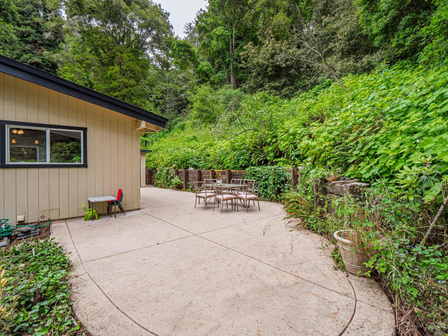 757 Cathedral Drive Aptos, CA 95003 - Photo 27 of 32 a view of a patio with table and chairs and potted plants
