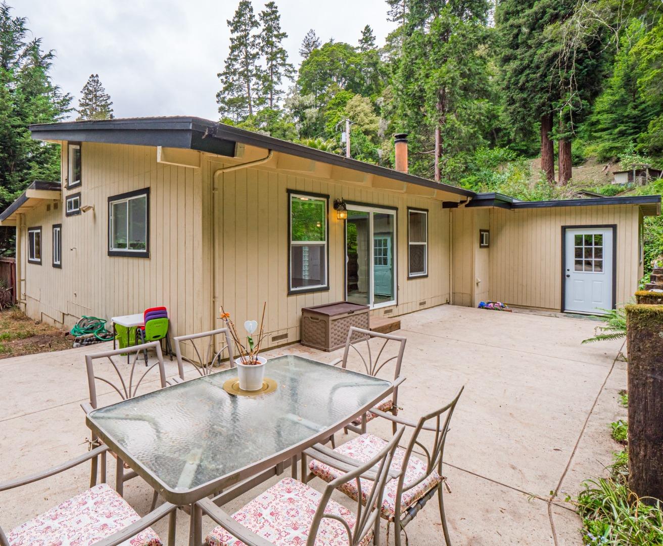757 Cathedral Drive Aptos, CA 95003 - Photo 28 of 32 a backyard of a house with yard table and chairs