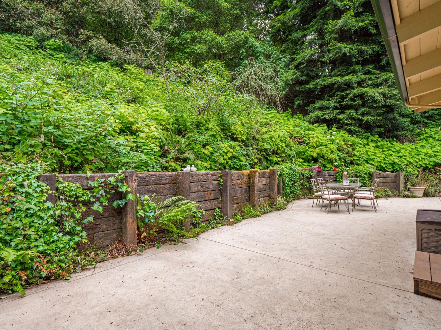 757 Cathedral Drive Aptos, CA 95003 - Photo 31 of 32 a view of backyard with a table and chairs and potted plants