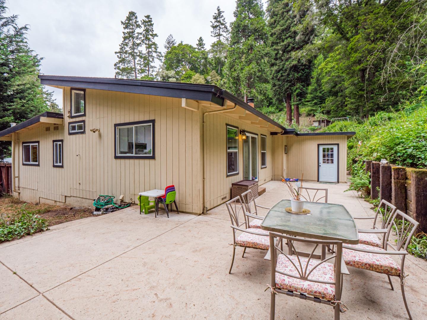 757 Cathedral Drive Aptos, CA 95003 - Photo 32 of 32 a backyard of a house with table and chairs