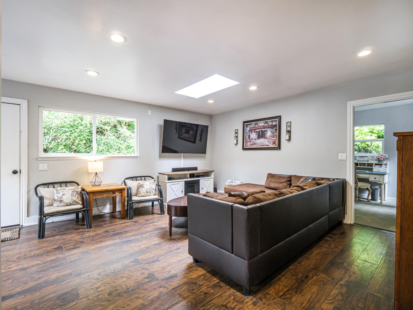 757 Cathedral Drive Aptos, CA 95003 - Photo 8 of 32 a living room with furniture a window and a flat screen tv