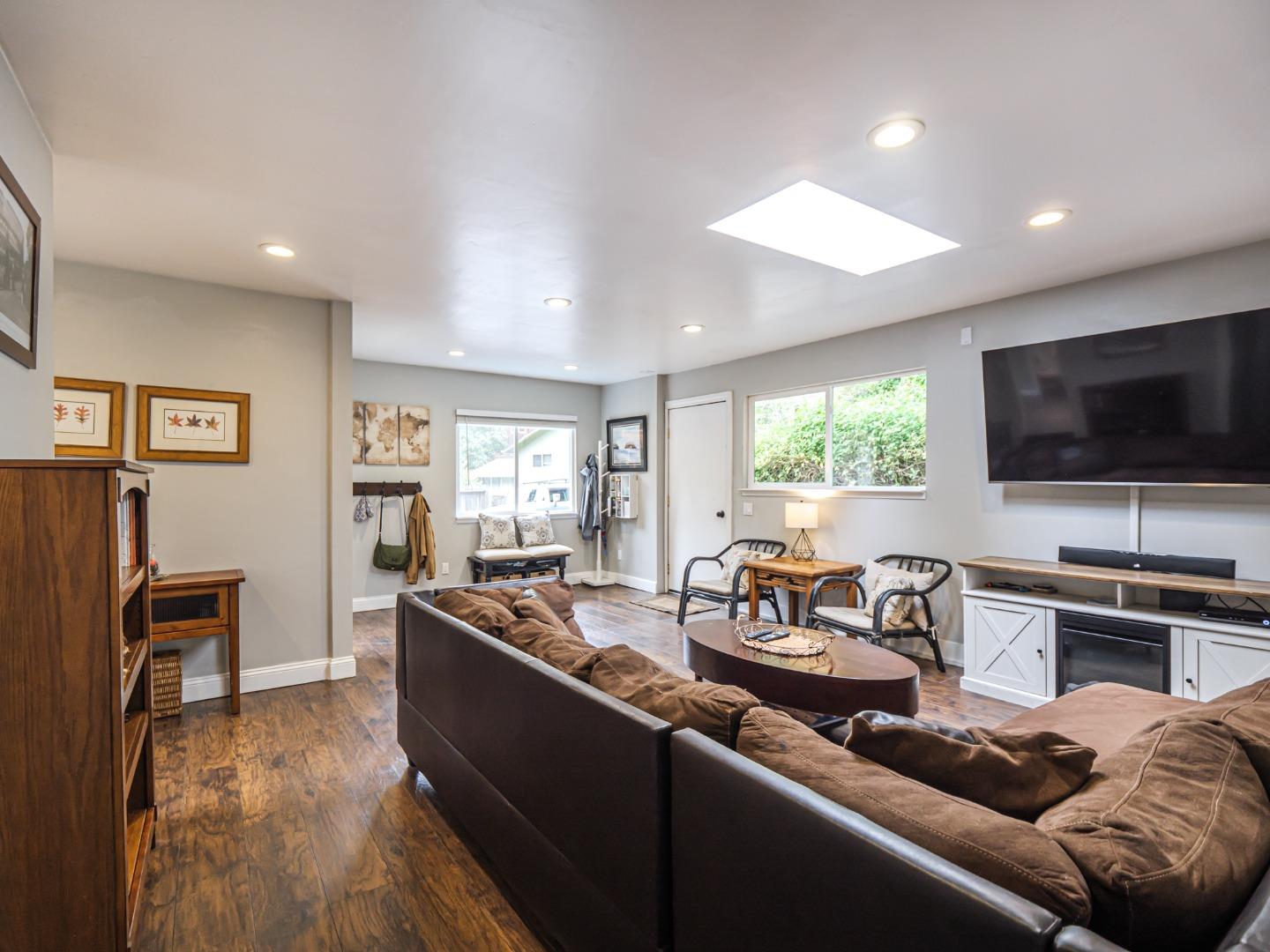 757 Cathedral Drive Aptos, CA 95003 - Photo 9 of 32 a living room with furniture and a flat screen tv