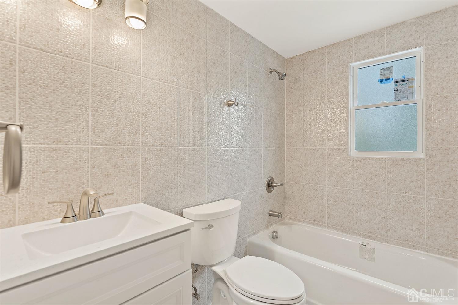 556 Chain O' Hills Road Colonia, NJ 07067 - Photo 14 of 24 a bathroom with a sink toilet and shower