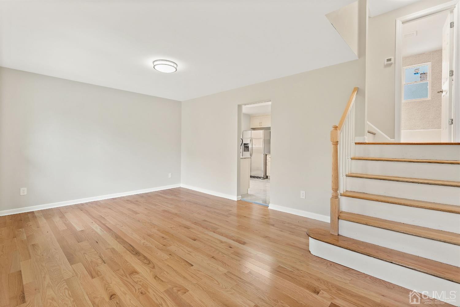 556 Chain O' Hills Road Colonia, NJ 07067 - Photo 15 of 24 a view of wooden floor and windows in a room