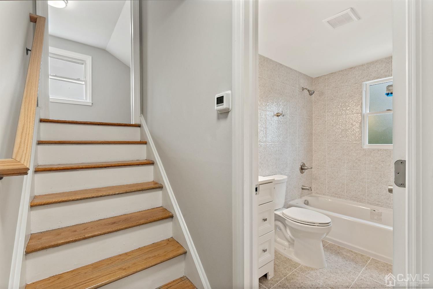 556 Chain O' Hills Road Colonia, NJ 07067 - Photo 20 of 24 a bathroom with a toilet and a shower