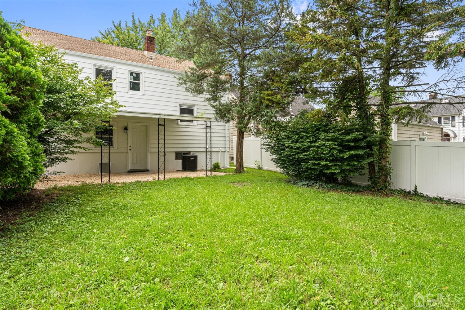 556 Chain O' Hills Road Colonia, NJ 07067 - Photo 22 of 24 a view of a house with backyard and garden