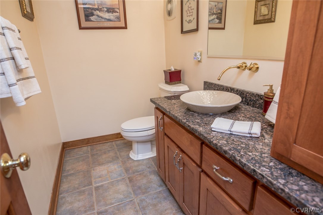 14101 Happy Hill Road Chester, VA 23831 - Photo 44 of 50 half bath off Great room with Spanish Stone floori