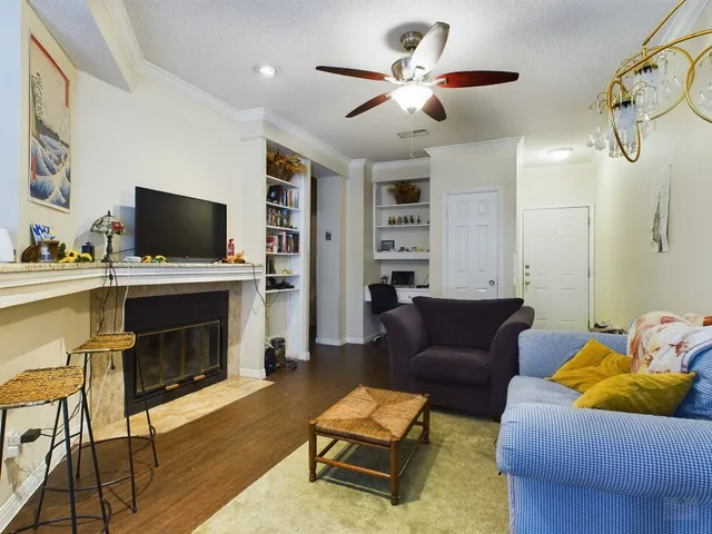 a kitchen with stainless steel appliances granite countertop a refrigerator a stove top oven a sink and dishwasher