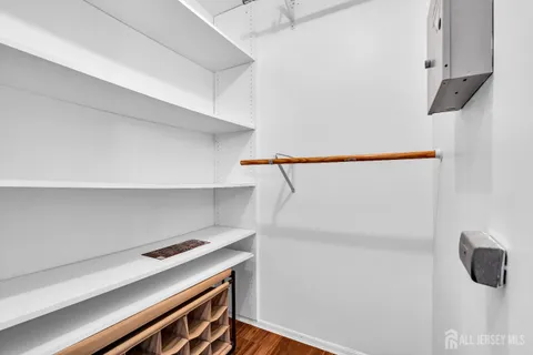 a view of storage and utility room with racks on the wall