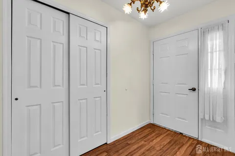 a view of an entryway with wooden floor