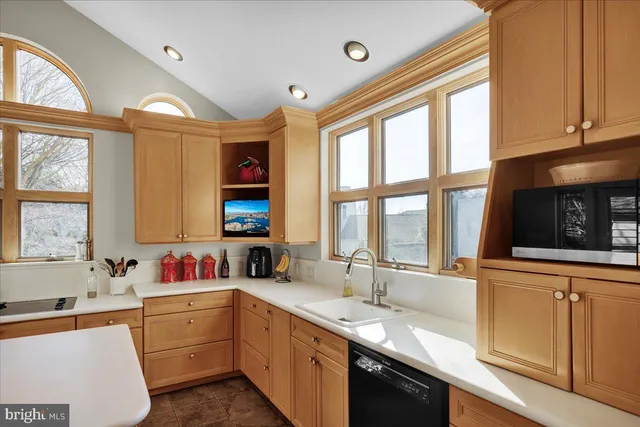 a kitchen with granite countertop a sink and a window