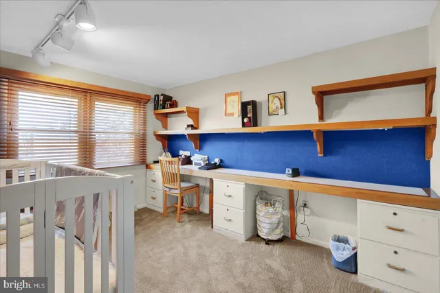 a room with a chair and a washing machine in a room