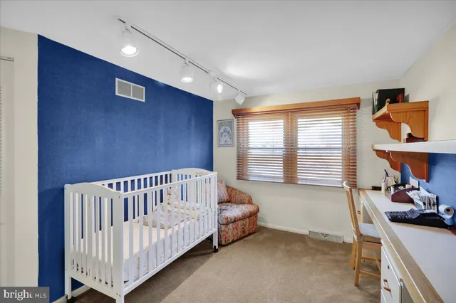 a room with a bed and window