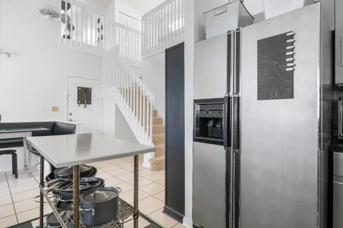 a view of a livingroom with furniture and kitchen