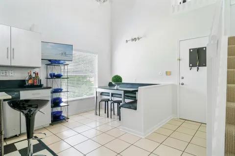 a kitchen with stainless steel appliances kitchen island granite countertop a sink and cabinets