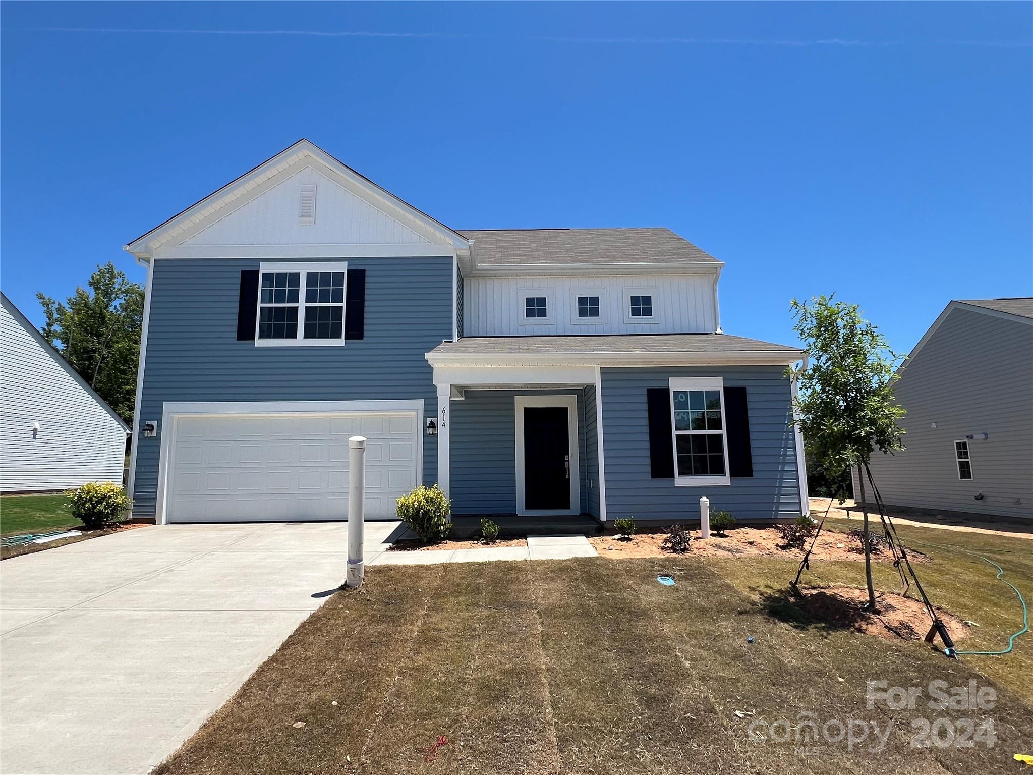 614 Mile Crk Road, Unit 30 Edgemoor, SC 29712 - Photo 2 of 31 a front view of a house with a yard