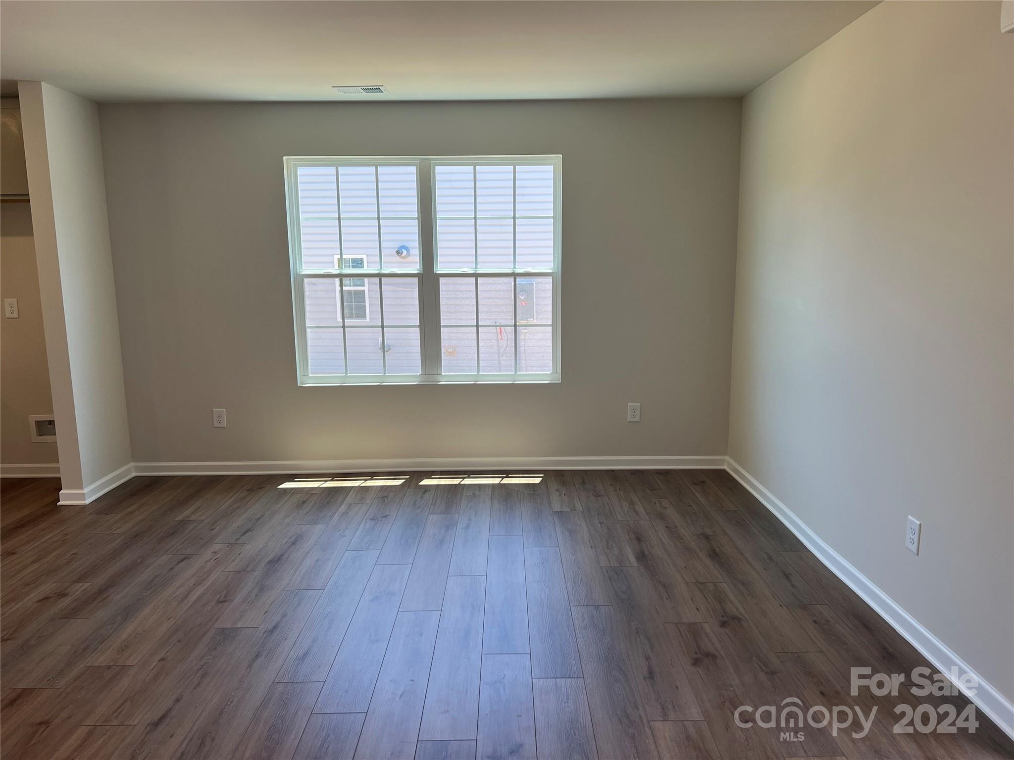 614 Mile Crk Road, Unit 30 Edgemoor, SC 29712 - Photo 7 of 31 an empty room with wooden floor and windows