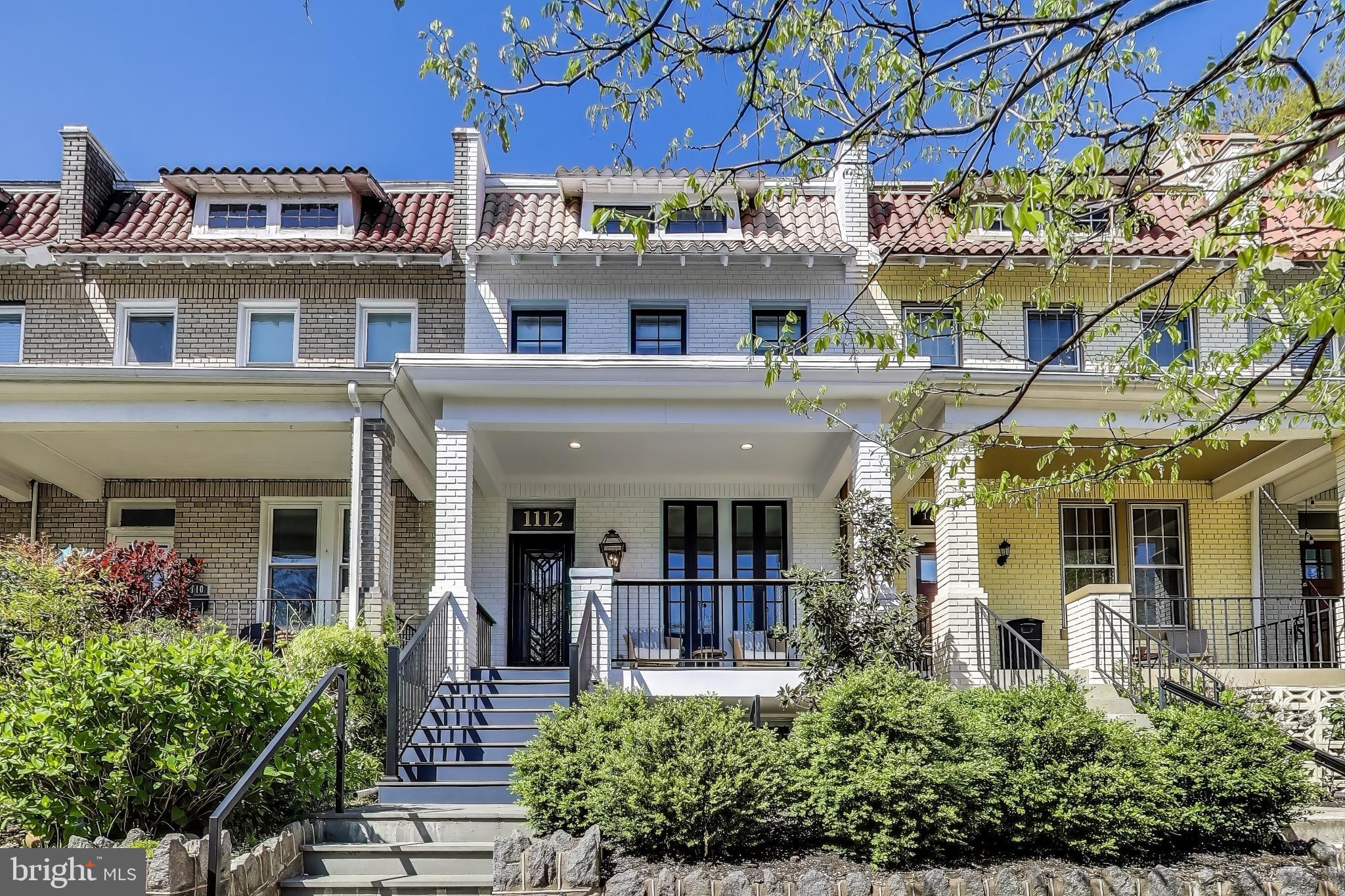 a front view of a building with garden