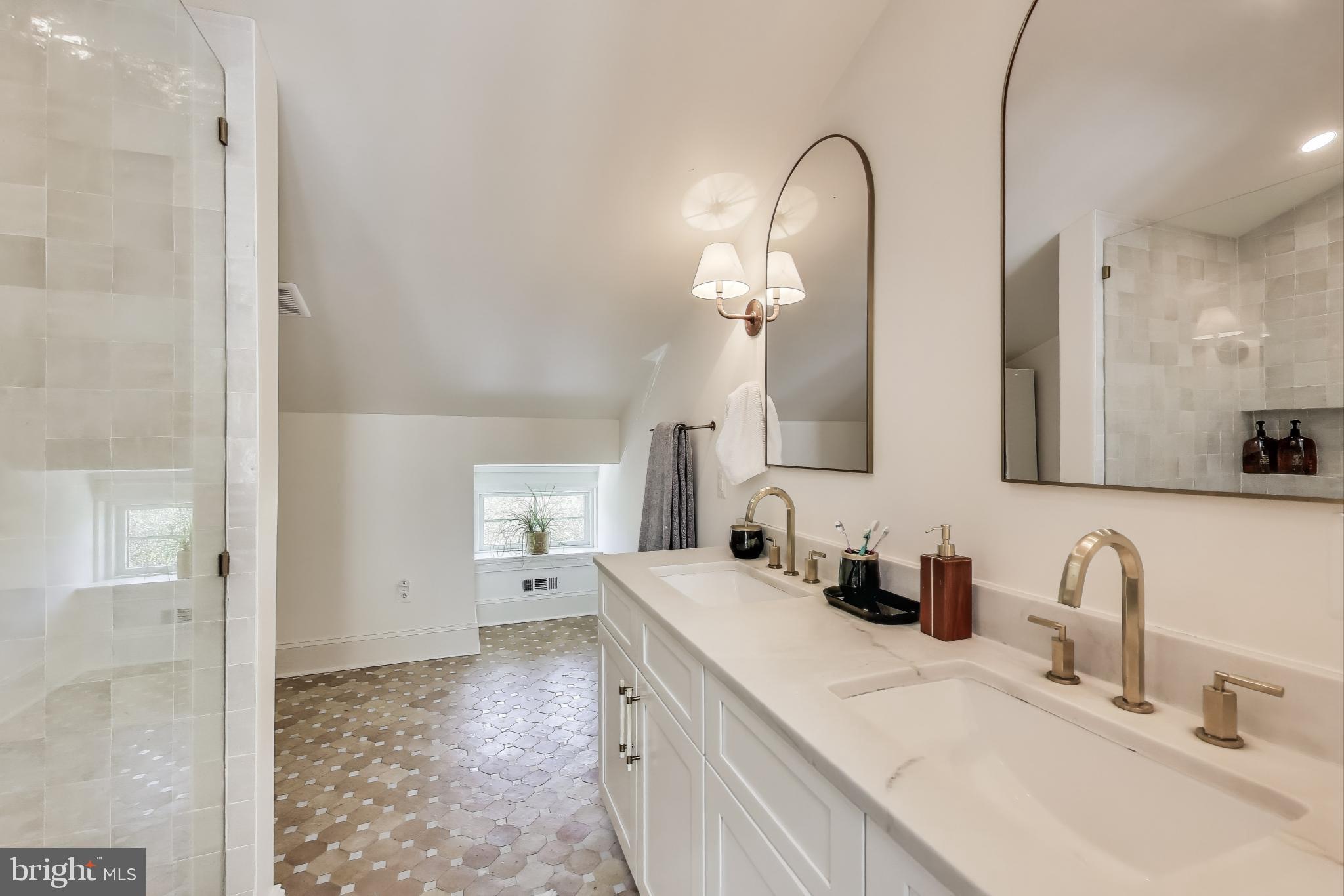 1112 E Street Northeast Washington, DC 20002 - Photo 16 of 29 a bathroom with a sink and a mirror
