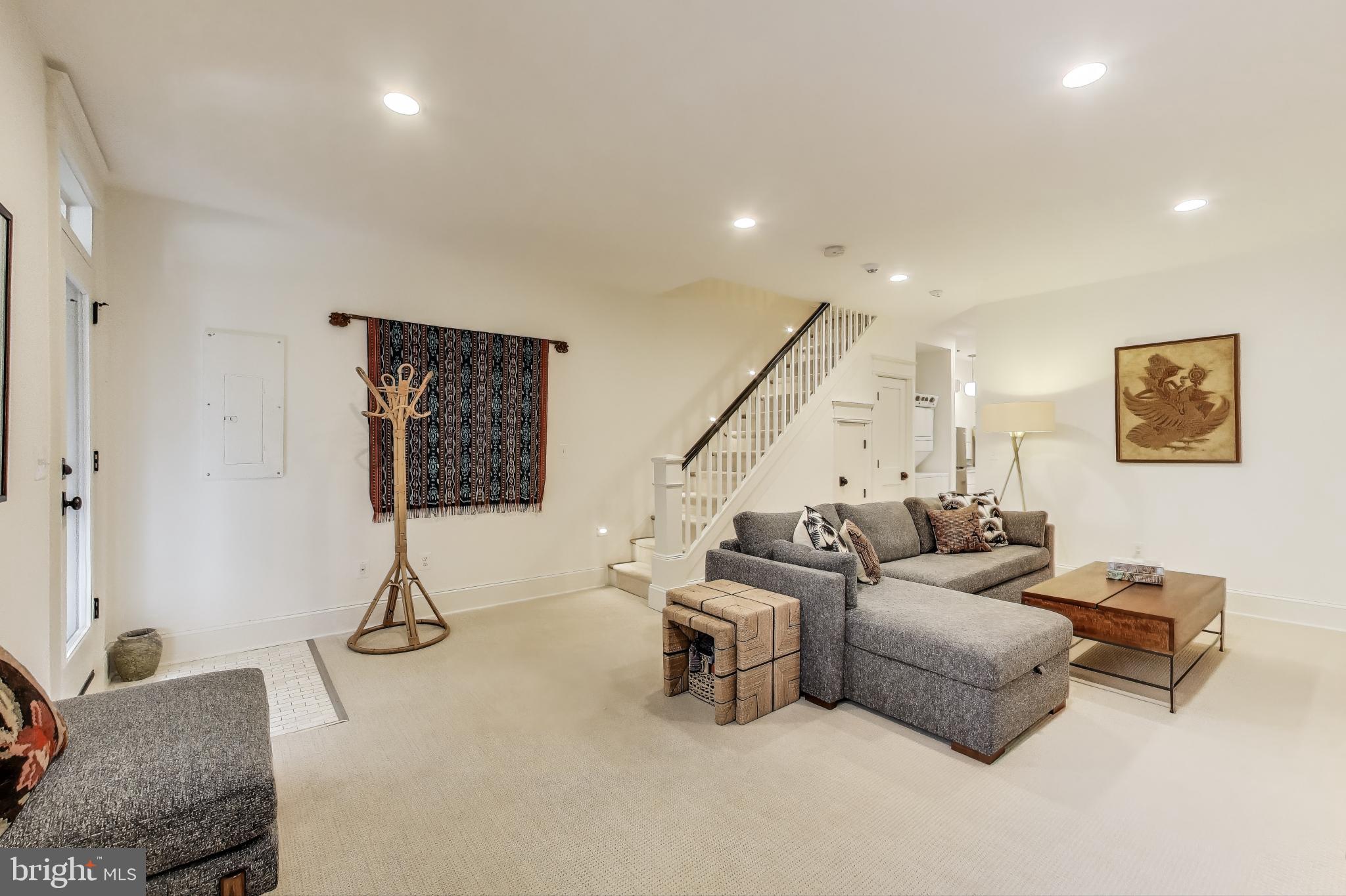 1112 E Street Northeast Washington, DC 20002 - Photo 18 of 29 a living room with furniture and stairs