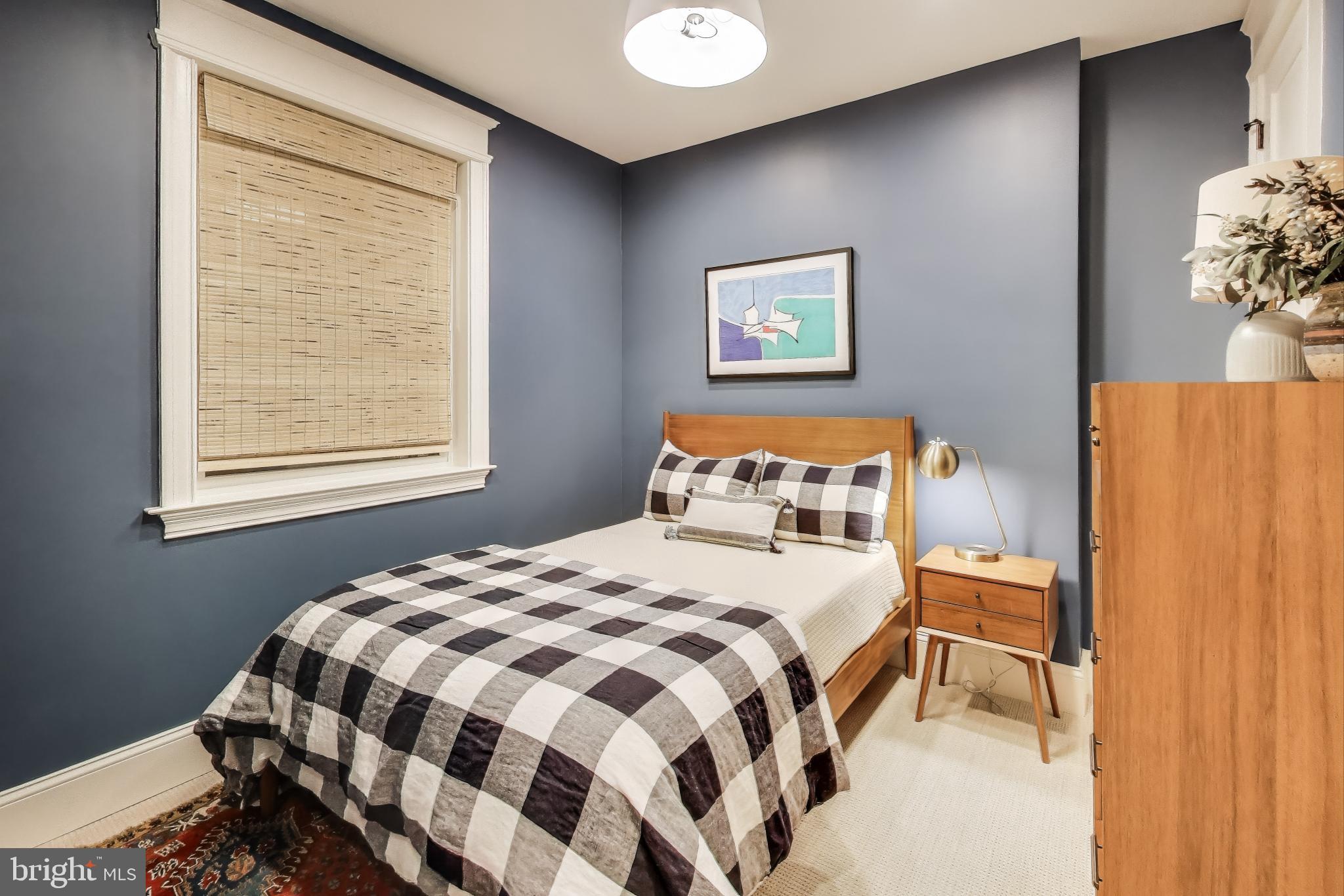 1112 E Street Northeast Washington, DC 20002 - Photo 21 of 29 a bedroom with a bed and a window