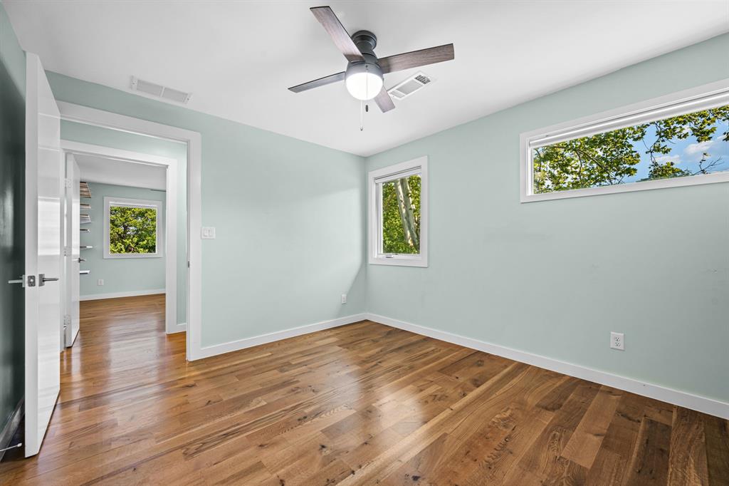 2547 Wentworth Street Dallas, TX 75211 - Photo 14 of 22 wooden floor in an empty room with a window