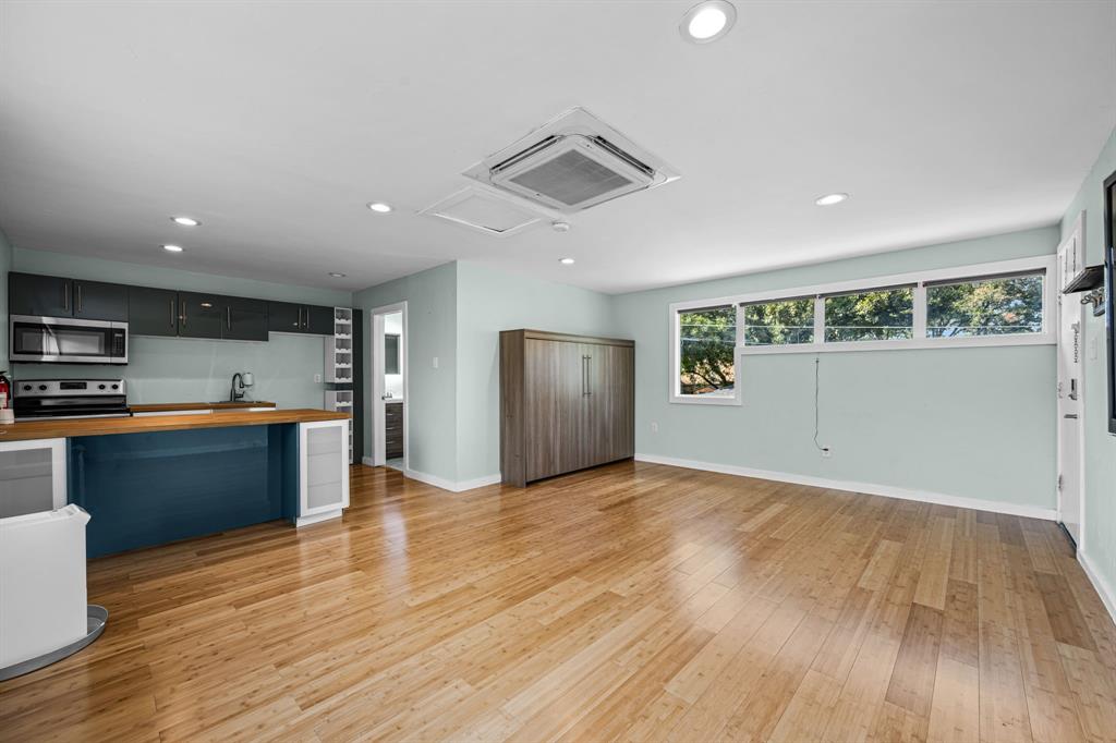 2547 Wentworth Street Dallas, TX 75211 - Photo 20 of 22 a view of kitchen with wooden floor and electronic appliances