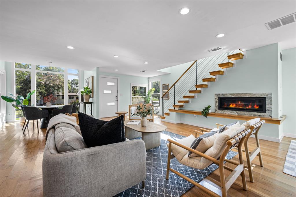 2547 Wentworth Street Dallas, TX 75211 - Photo 3 of 22 a living room with fireplace furniture and a flat screen tv