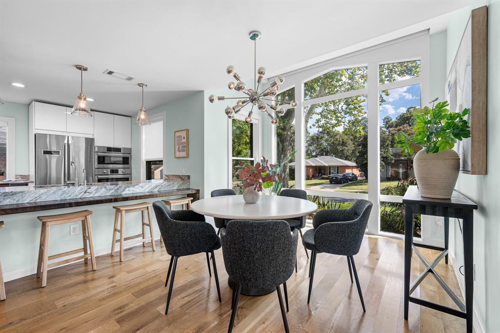 2547 Wentworth Street Dallas, TX 75211 - Photo 4 of 22 a view of a dining room with furniture window and wooden floor