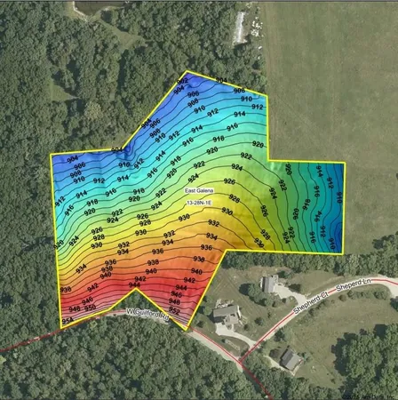 a view of a big yard with lots of green space