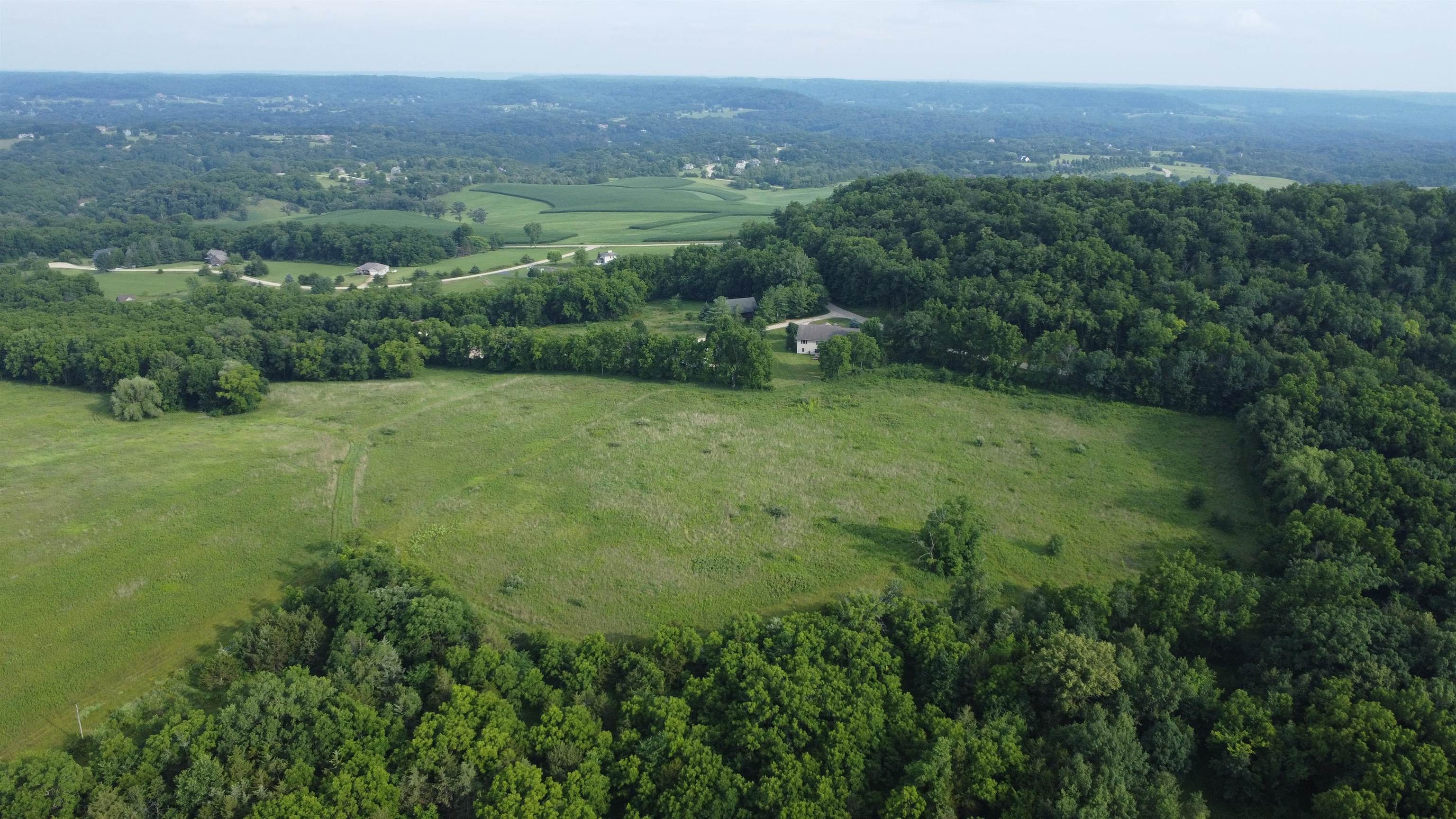 Tbd West Guilford Road Galena, IL 61036 - Photo 2 of 21 a view of a lush green forest with trees and some houses