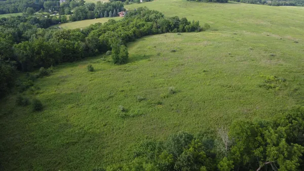 a view of a big yard with green space
