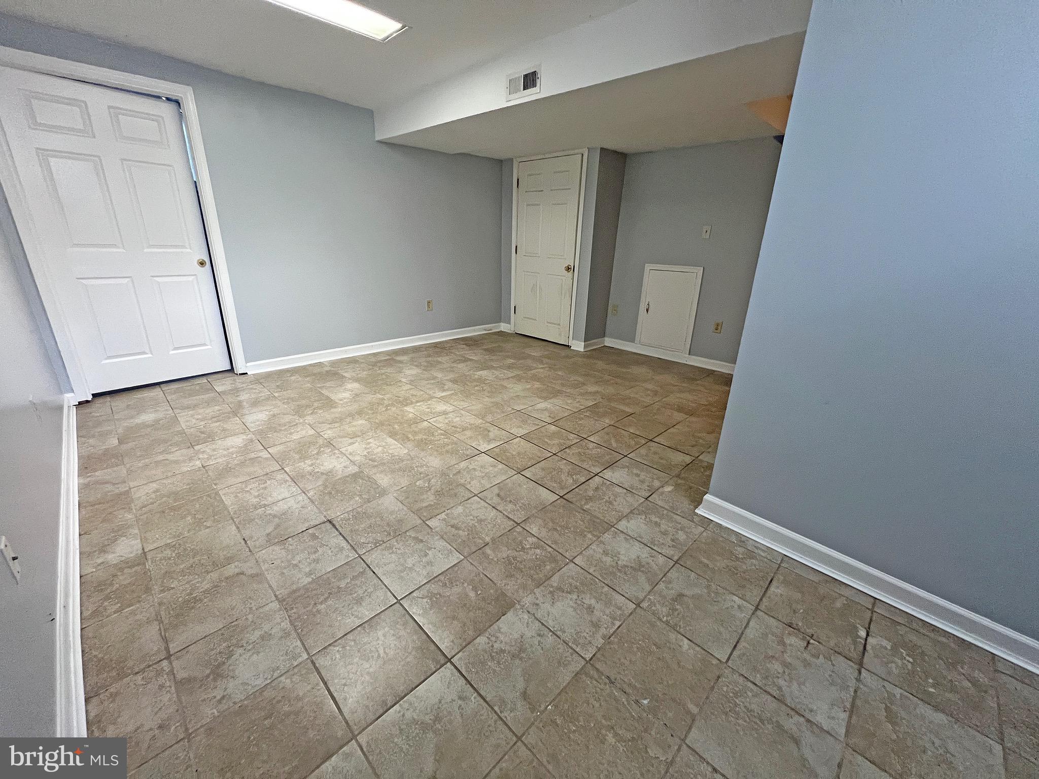 1049 Old Forge Road New Castle, DE 19720 - Photo 23 of 27 Lower level recreation room with tile floors