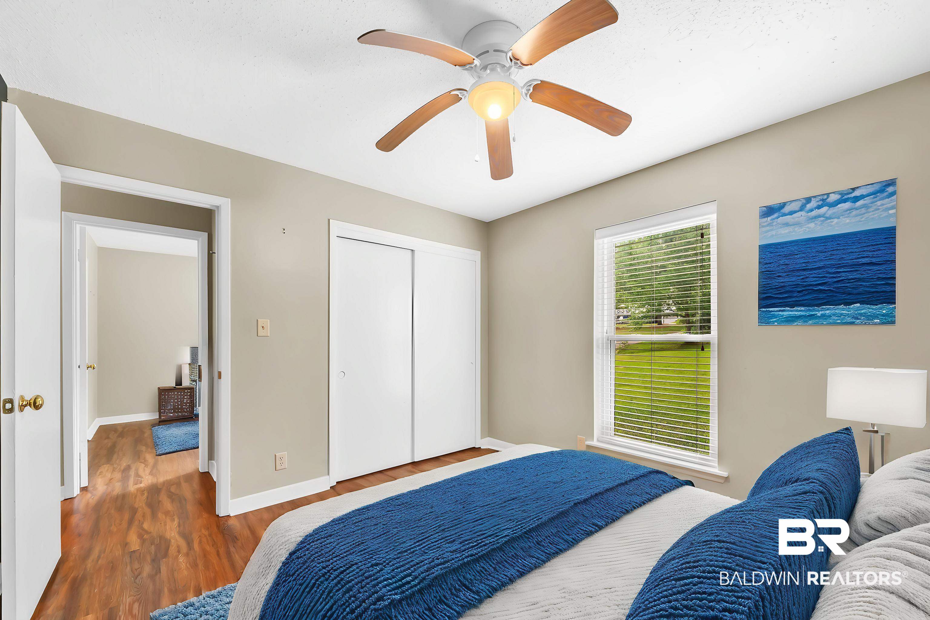 28 Caisson Trace Spanish Fort, AL 36527 - Photo 37 of 51 Bedroom featuring baseboards, wood finished floors, ceiling fan, and a closet